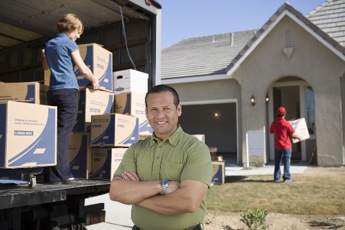 Local movers handling furniture and boxes near Gospel Oak flats
