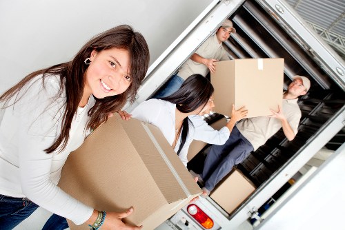 Removalists loading household items into a van for a Gospel Oak move